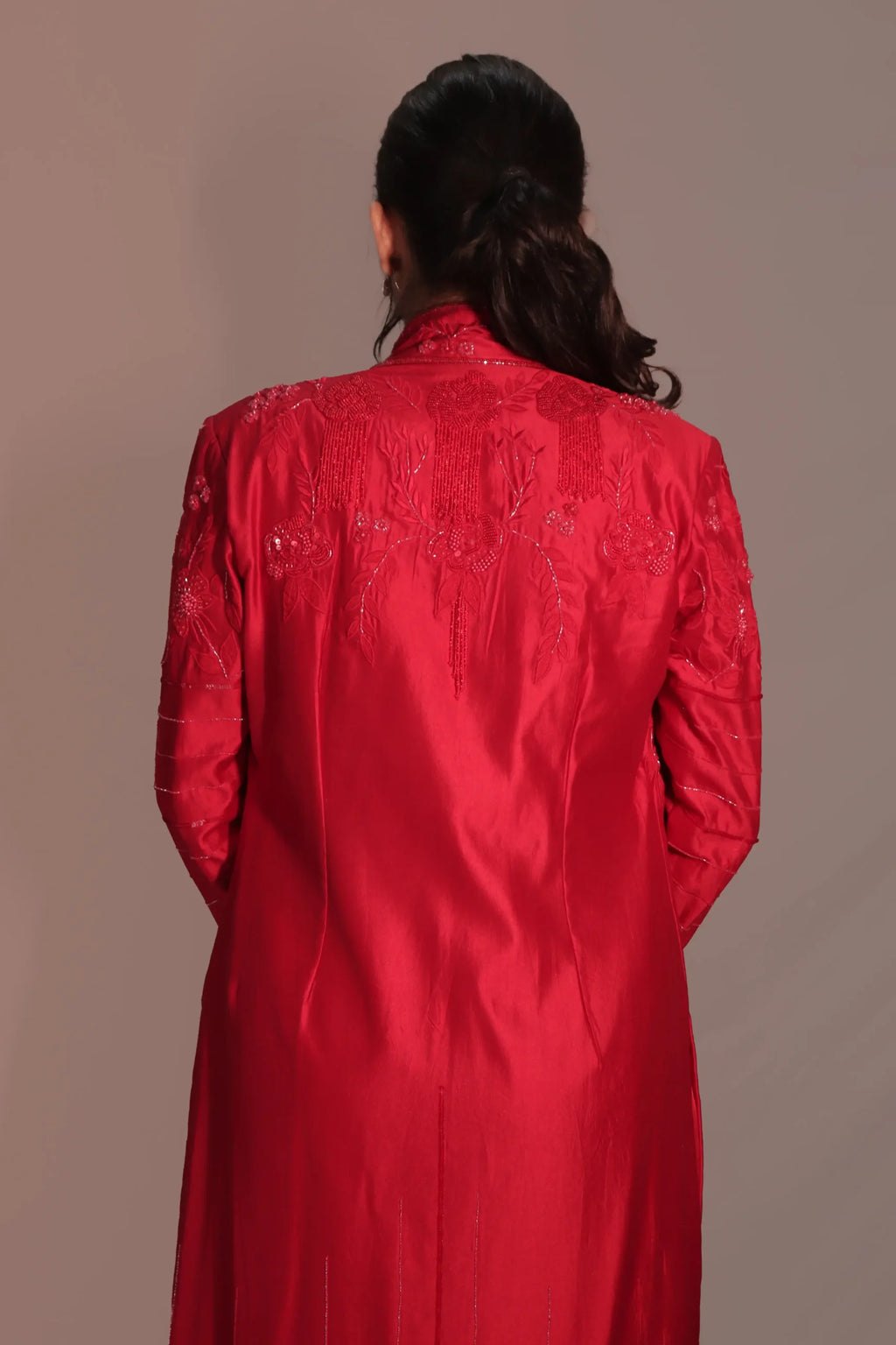 Long jacket with flared pants and bustier